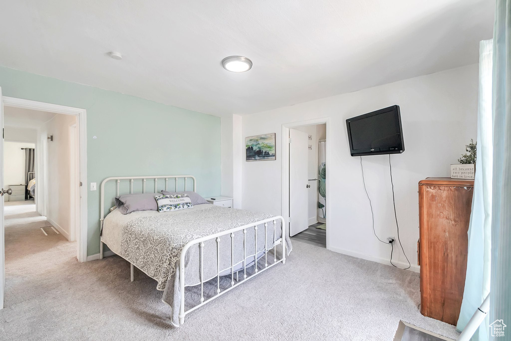 Carpeted bedroom featuring baseboards