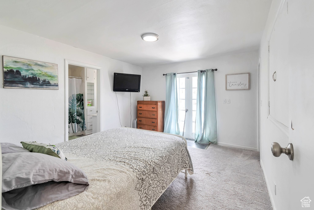 Bedroom featuring carpet flooring and baseboards