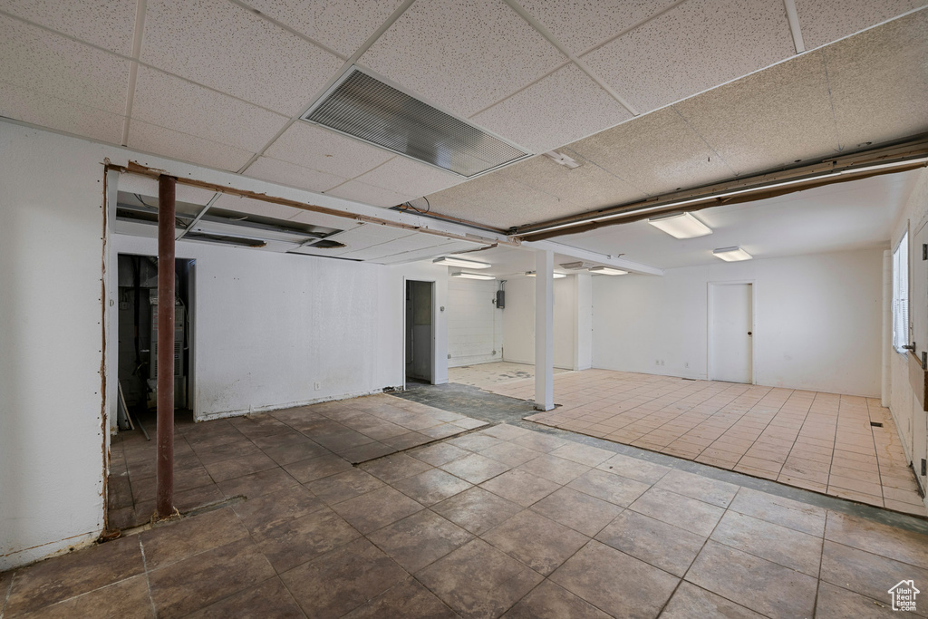 Finished basement with a drop ceiling