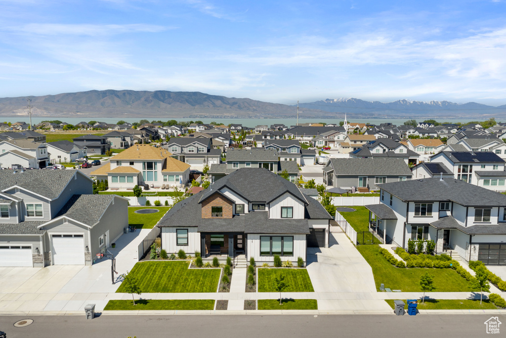 Aerial view of residential area featuring a mountain backdrop