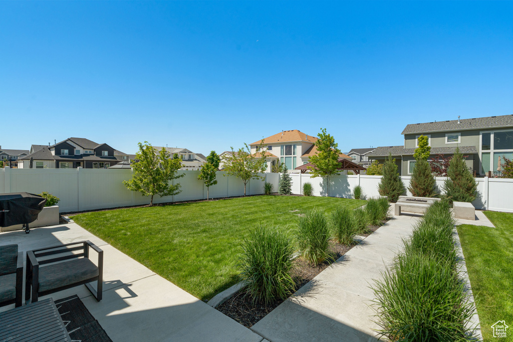 View of yard featuring a residential view and a patio area