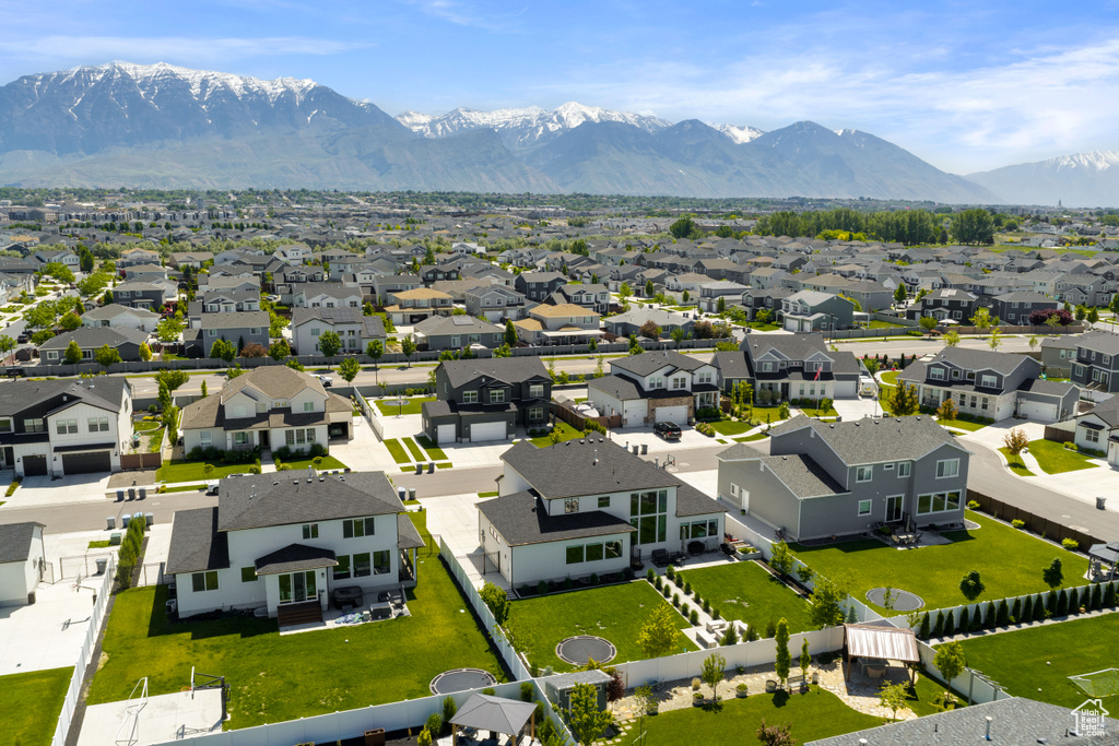 Aerial perspective of suburban area with a mountainous background