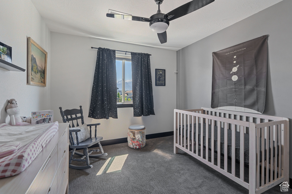 Bedroom with carpet, ceiling fan, and baseboards