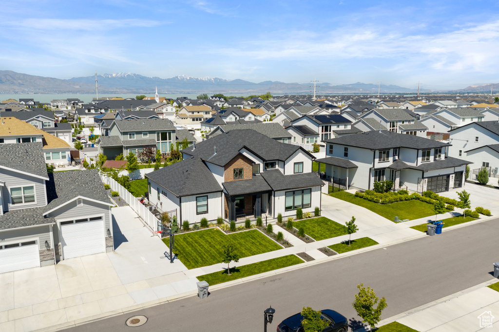 Aerial view of residential area with a mountainous background