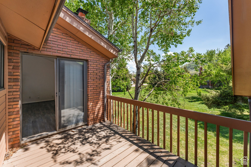 Deck featuring a lawn