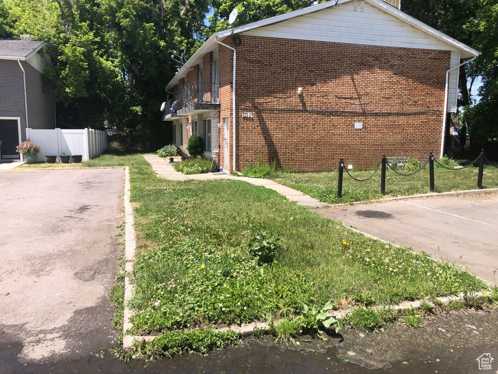 View of side of home with brick siding