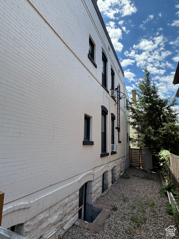 View of property exterior featuring brick siding
