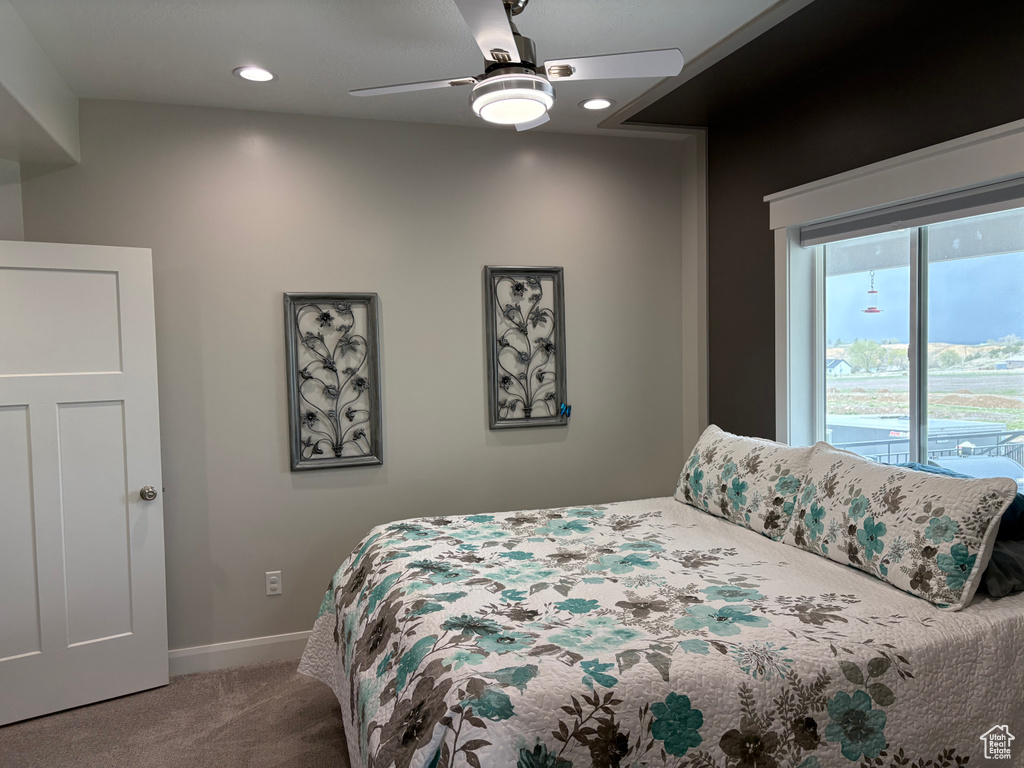 Bedroom with carpet flooring, baseboards, a ceiling fan, and recessed lighting