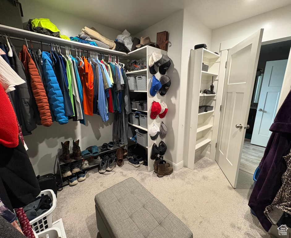 Spacious closet with carpet flooring