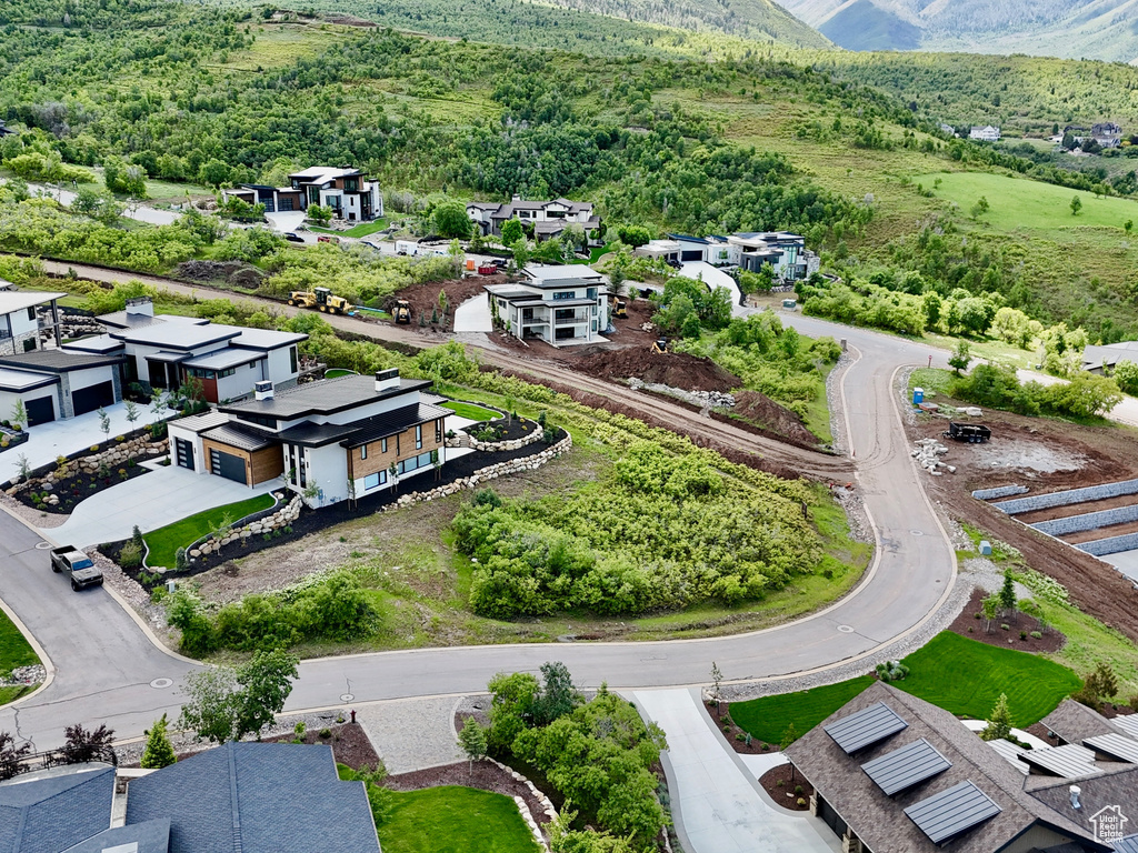 Aerial perspective of suburban area featuring a mountainous background