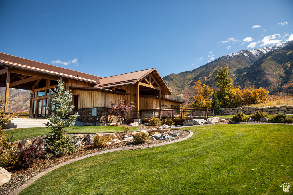 View of green lawn with a mountain view