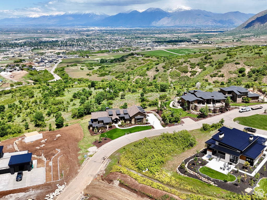 Aerial view of residential area featuring a mountainous background