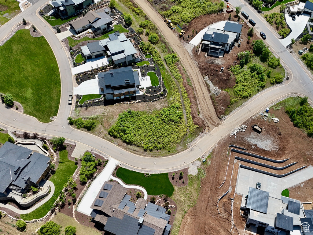 Aerial view of property and surrounding area with nearby suburban area