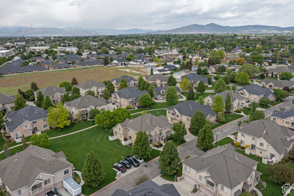 Aerial view of residential area featuring a mountainous background