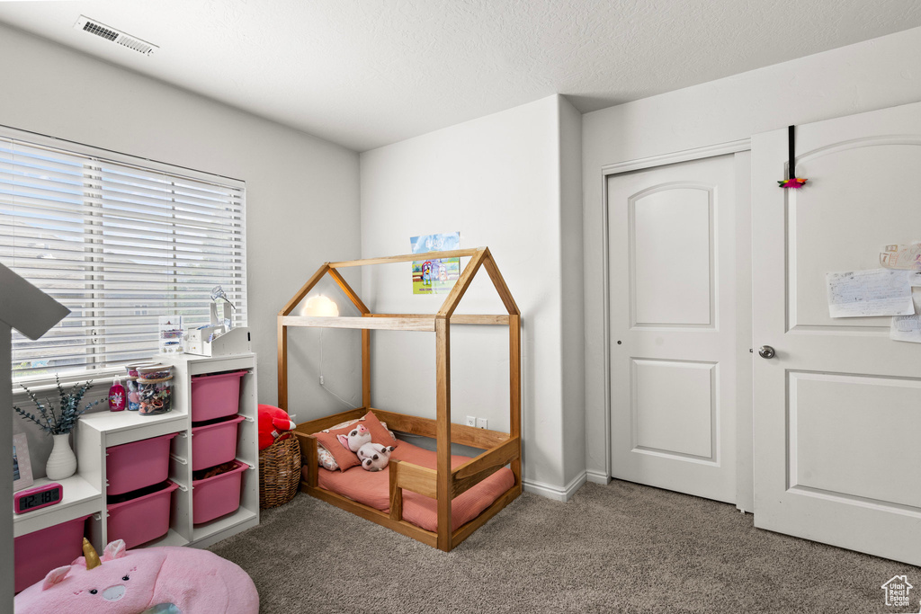View of carpeted bedroom