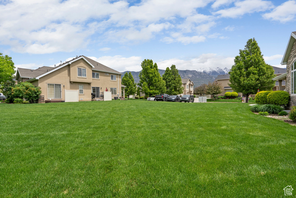 View of green lawn with a mountain view