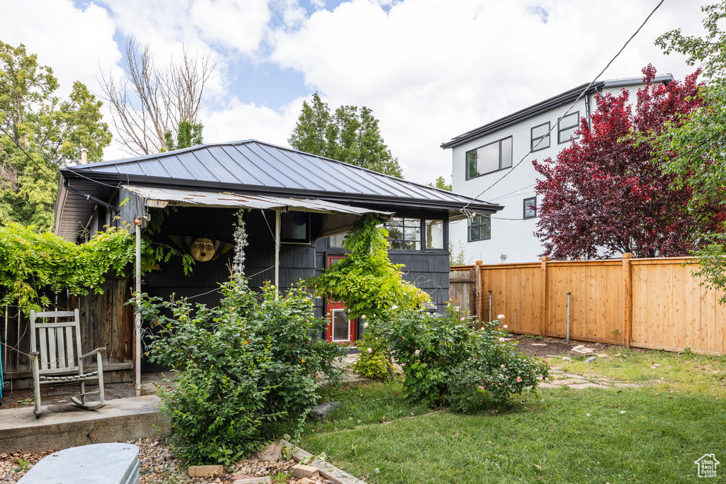 View of front of house with metal roof and a standing seam roof