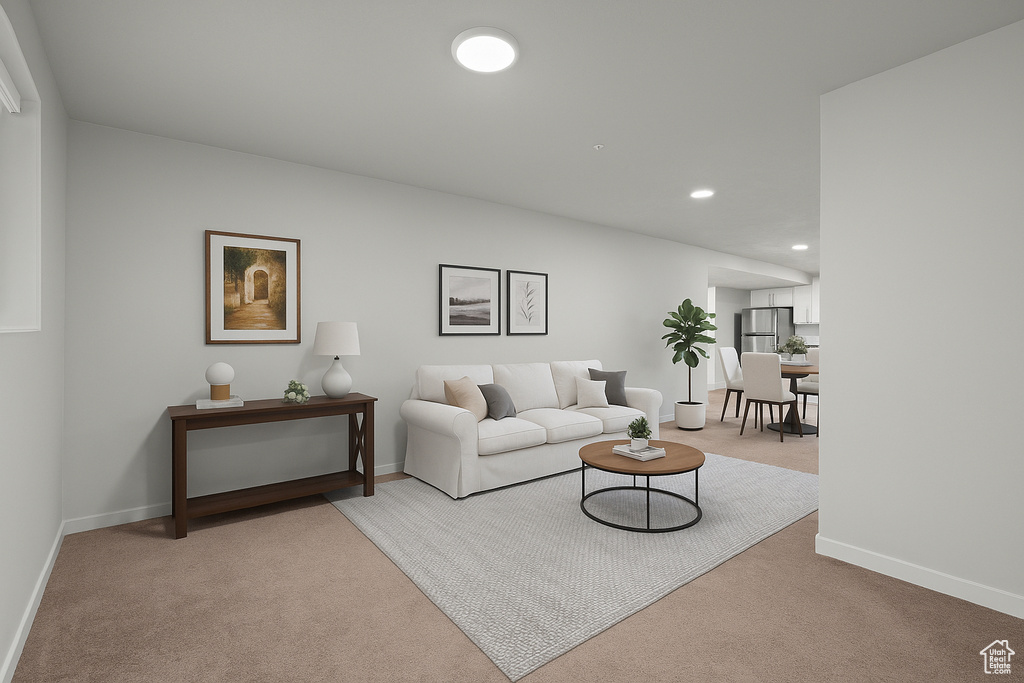Carpeted living area featuring baseboards and recessed lighting