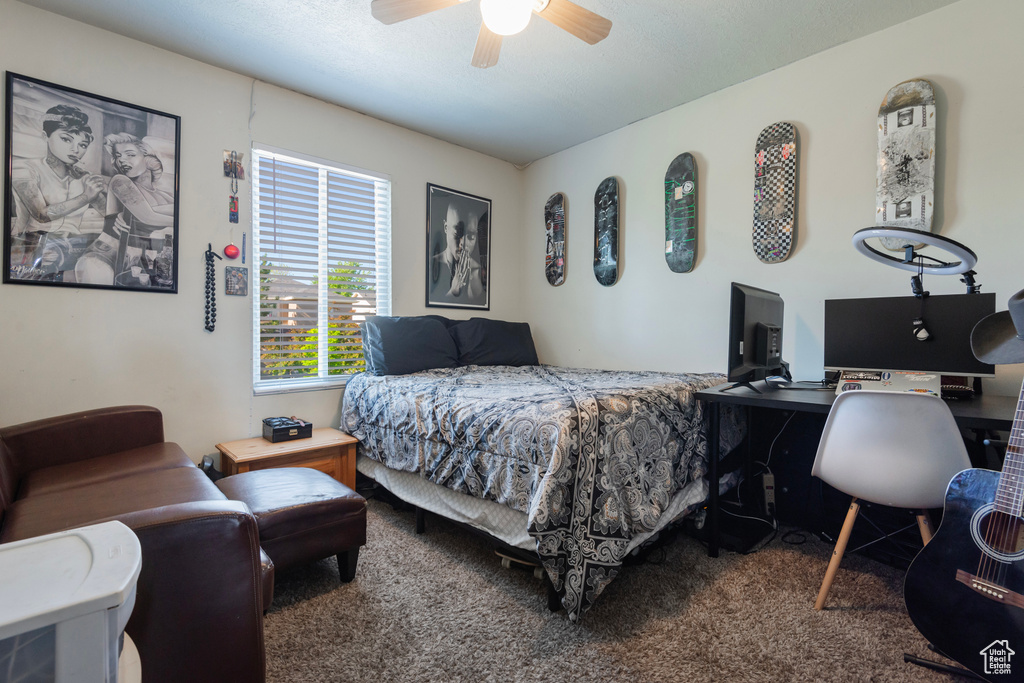 Bedroom featuring carpet flooring, an office area, and ceiling fan