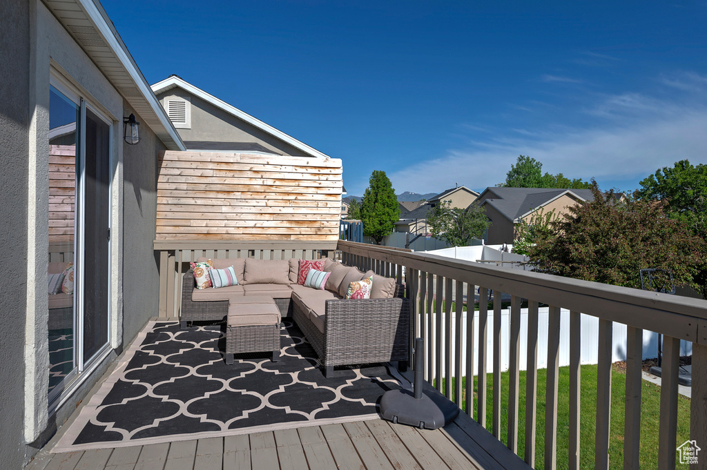 Deck featuring an outdoor living space and a residential view