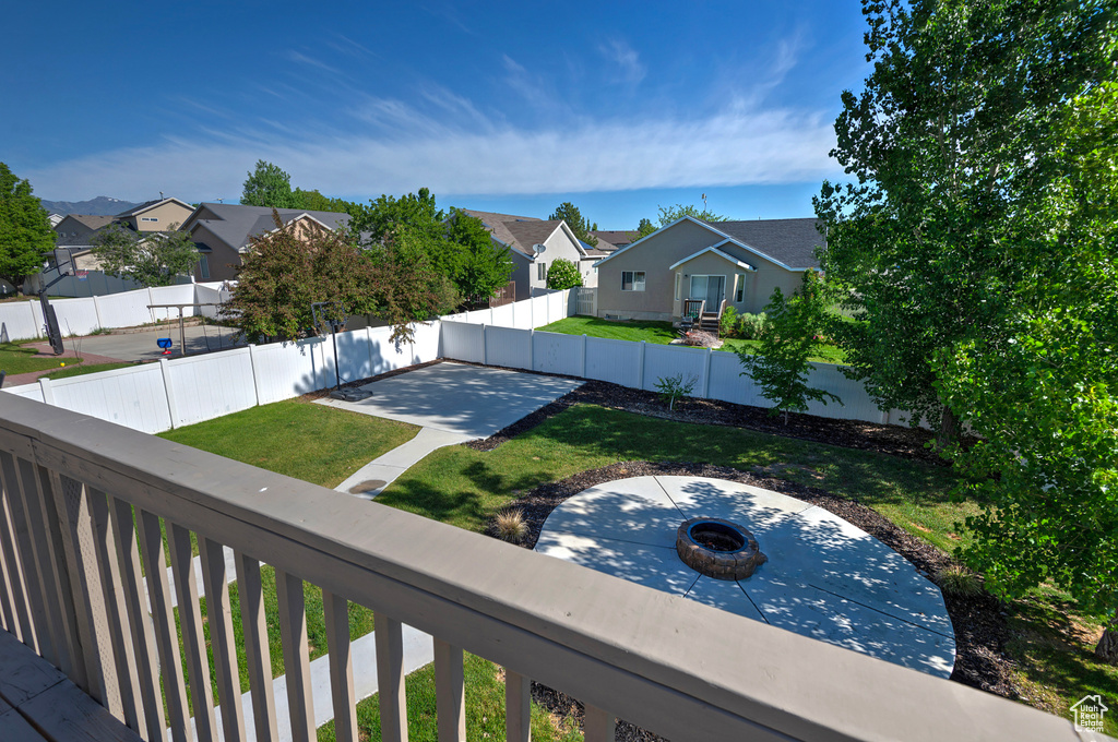 View of yard featuring a residential view, a patio area, and a fire pit