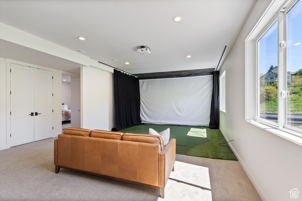 Cinema room featuring light carpet, recessed lighting, and baseboards