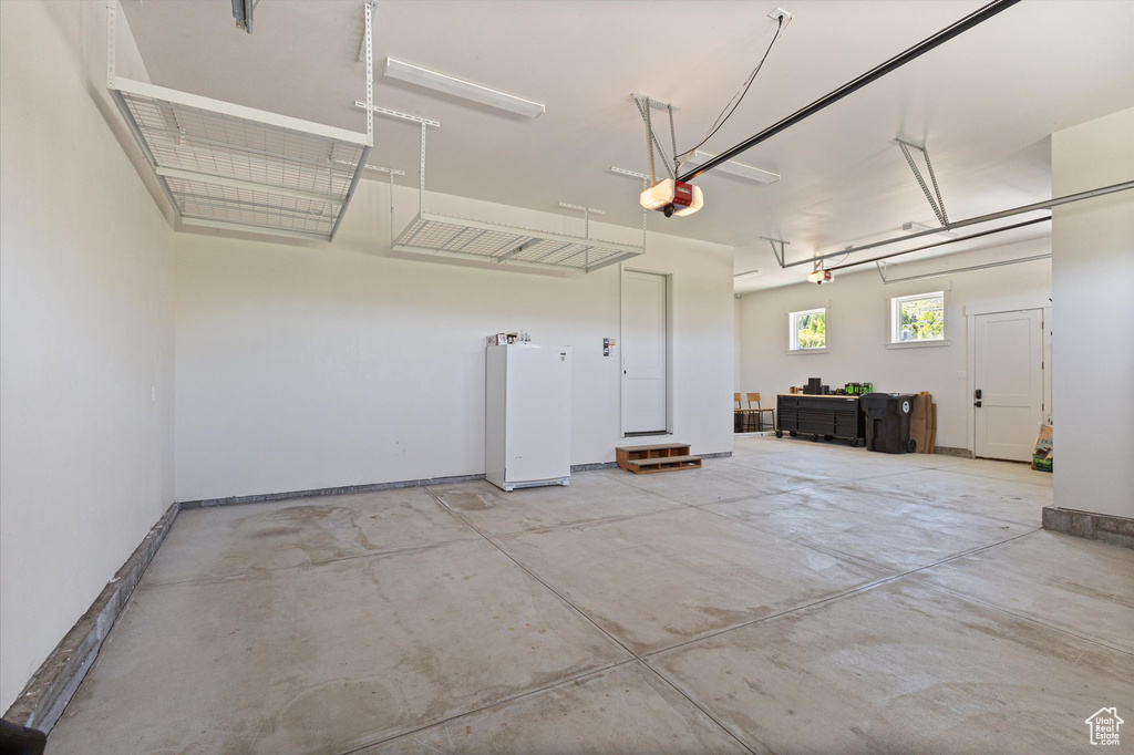 Garage featuring a garage door opener