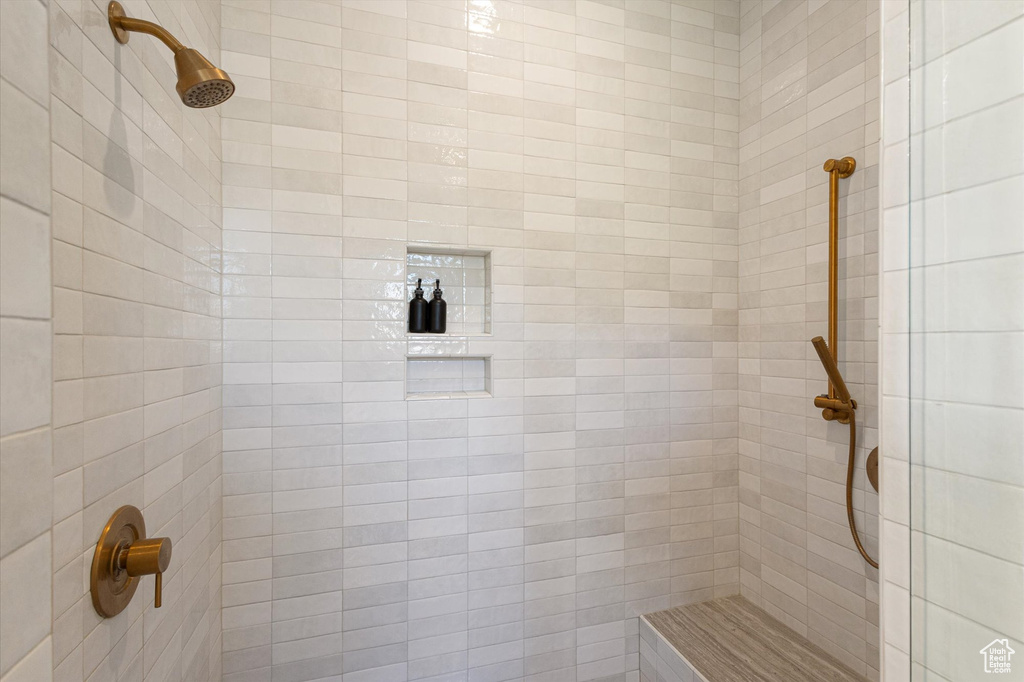 Full bath with a tile shower