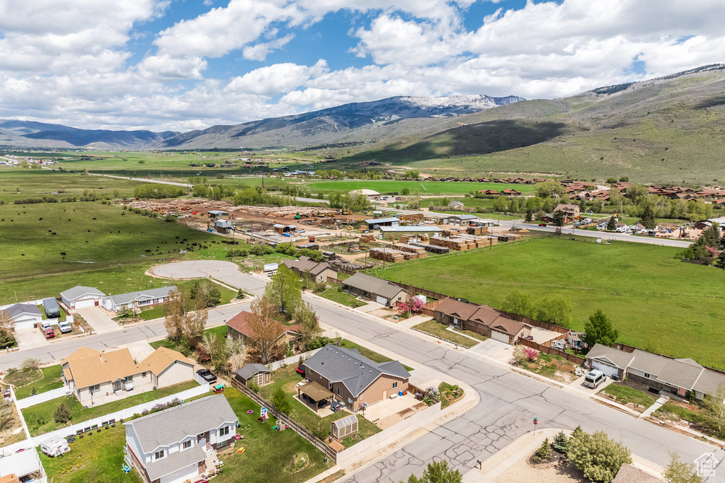 Aerial view of residential area featuring a mountain backdrop