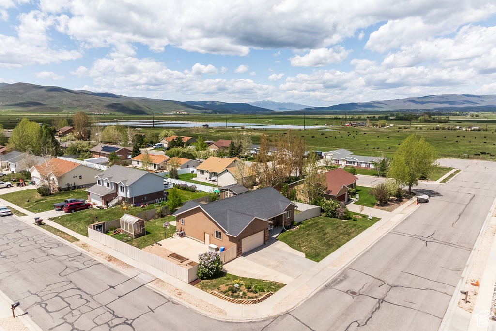 Aerial view of residential area featuring a water and mountain view