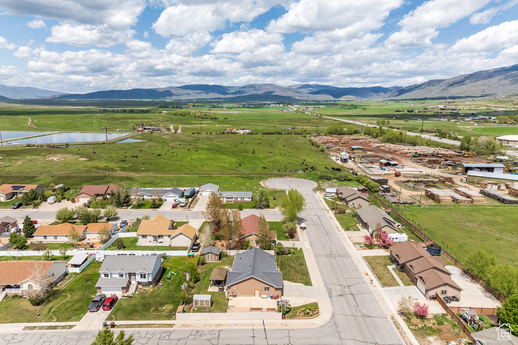 Aerial perspective of suburban area with a water and mountain view