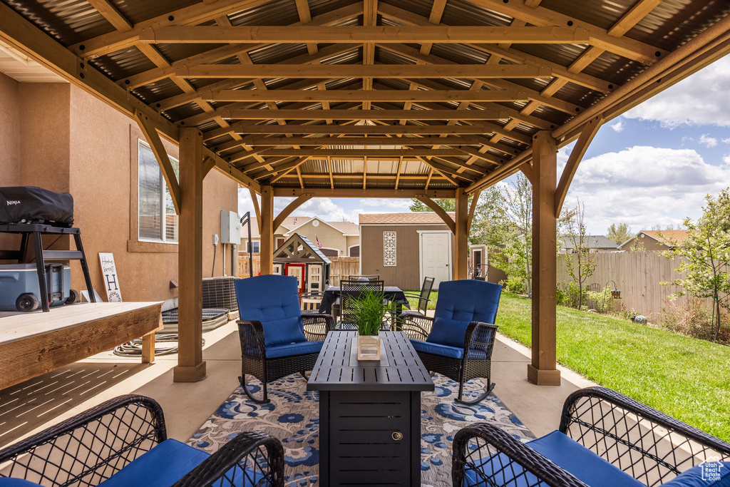 Fenced backyard with a patio and an outdoor hangout area