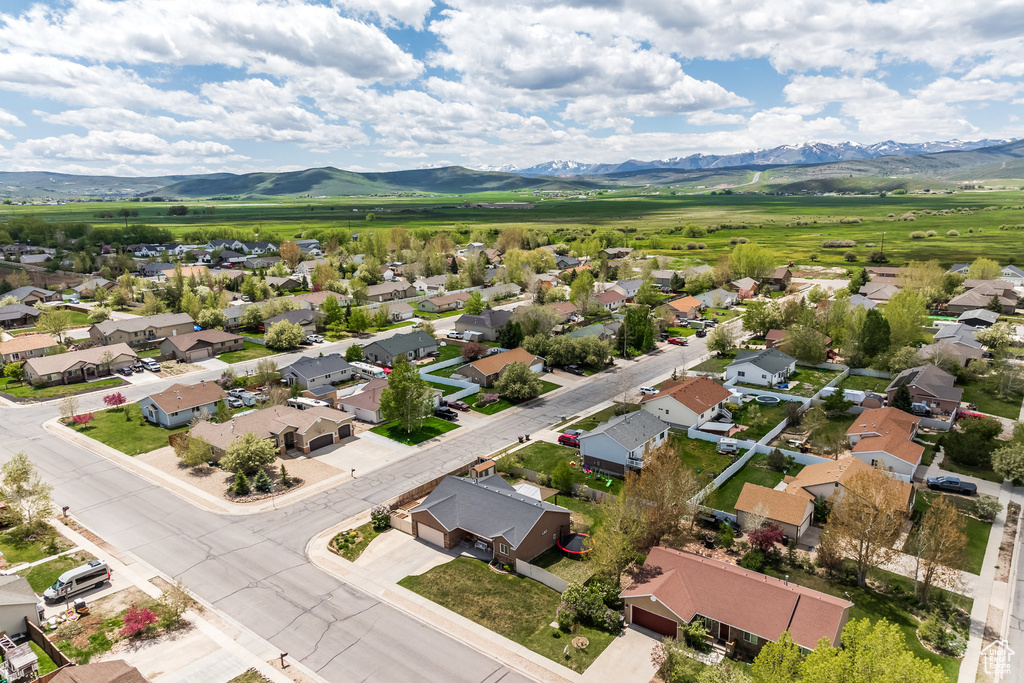 Aerial perspective of suburban area featuring a mountainous background