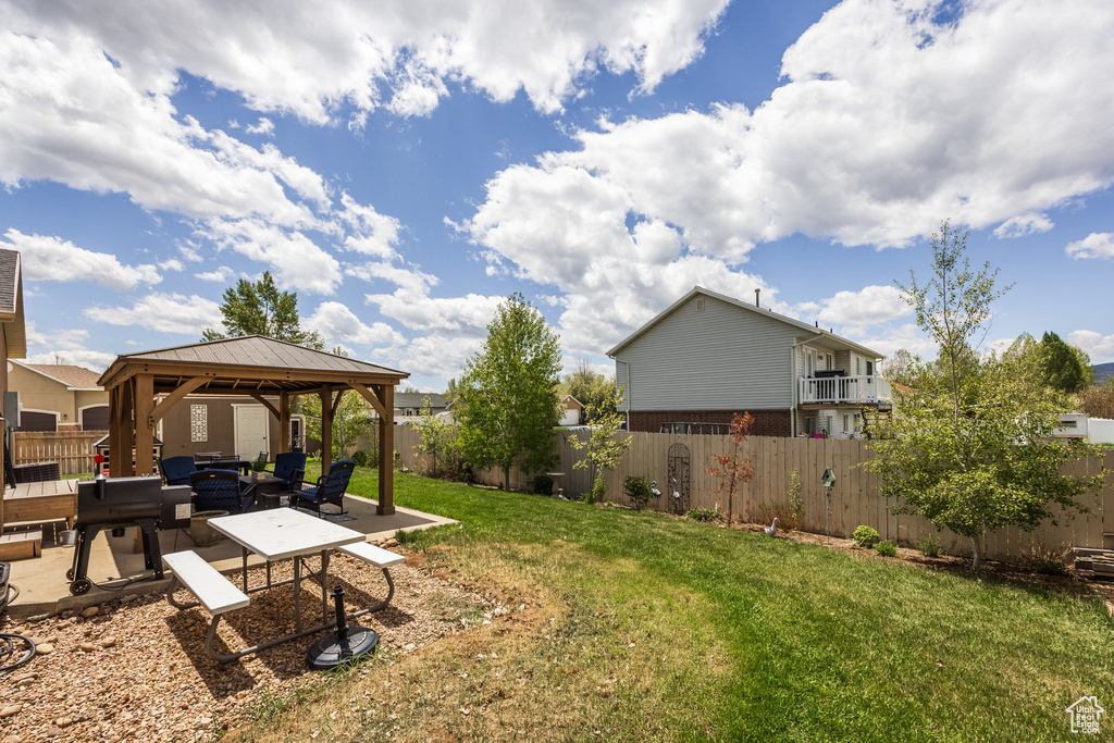 View of yard with a gazebo, a patio area, and an outdoor living space