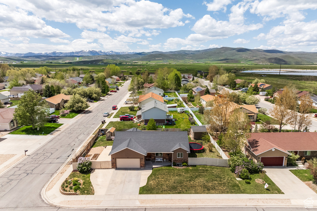 Aerial view of residential area with a mountainous background