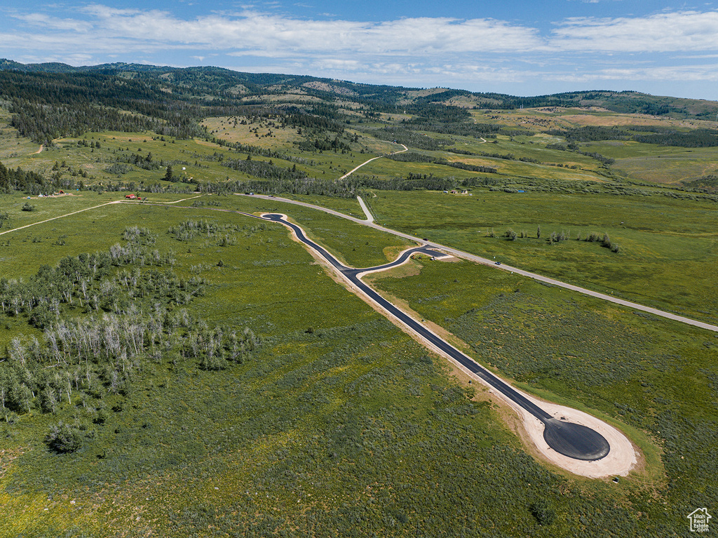 Aerial view of property's location featuring rural landscape and mountains