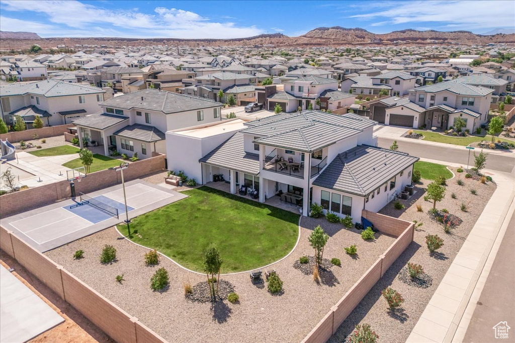 Aerial view of residential area featuring mountains