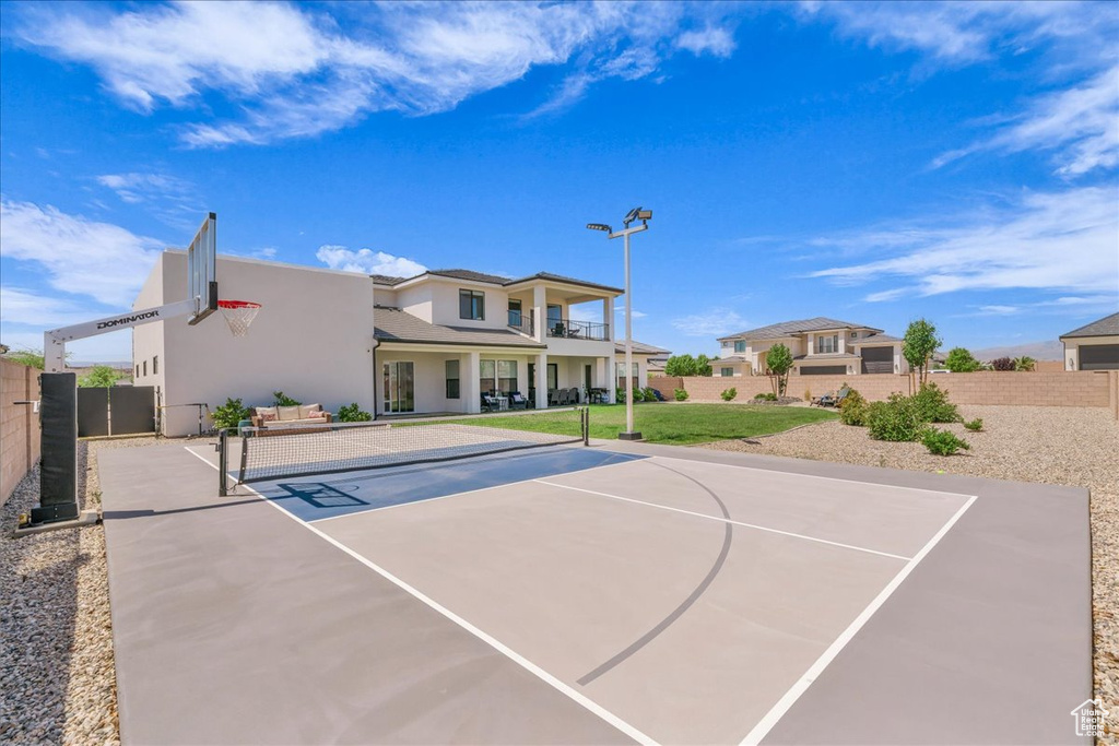 View of sport court featuring basketball hoop