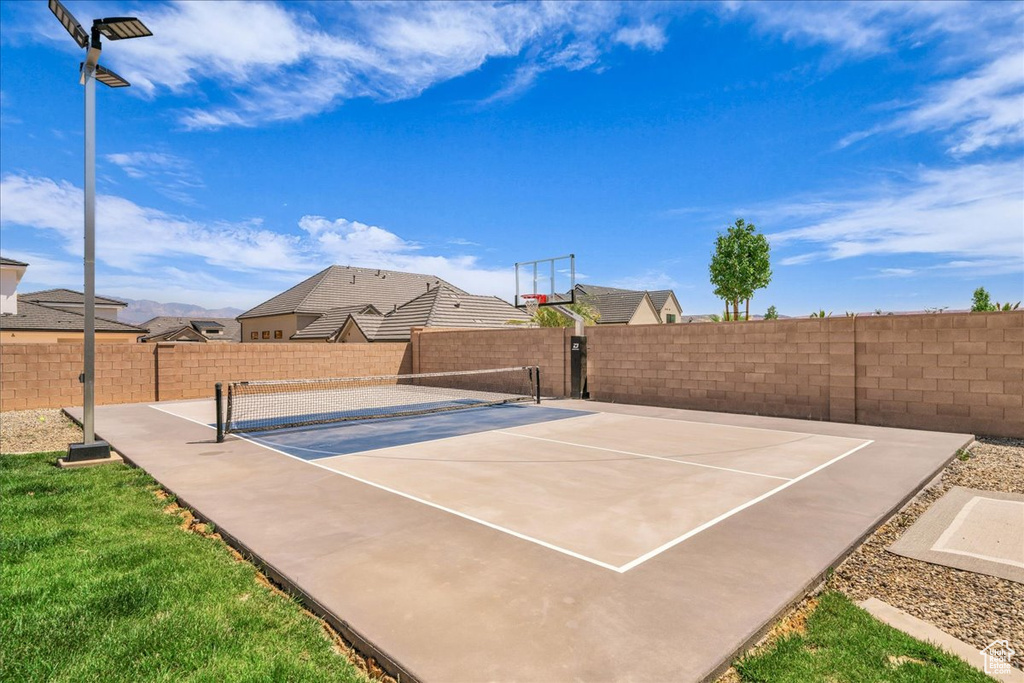 View of basketball court with basketball court and a tennis court