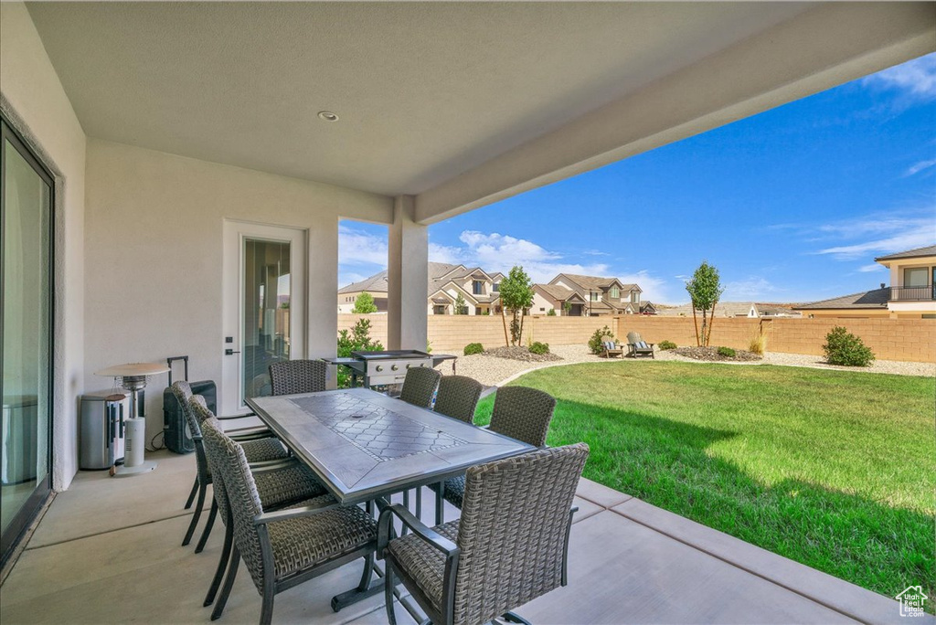 View of patio / terrace with outdoor dining space and a residential view