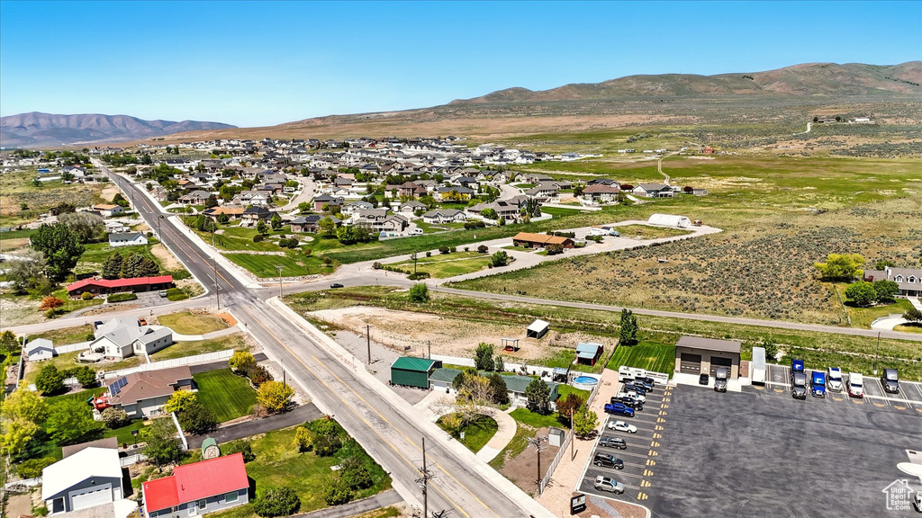 Aerial view of property\'s location with mountains and nearby suburban area