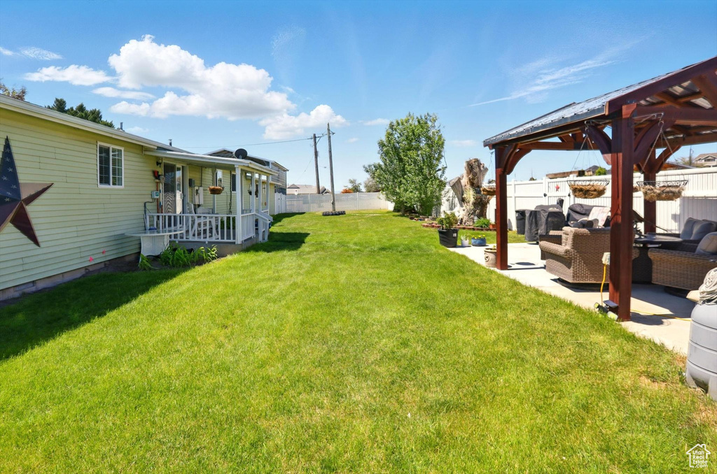View of yard featuring a gazebo, outdoor lounge area, and a patio area