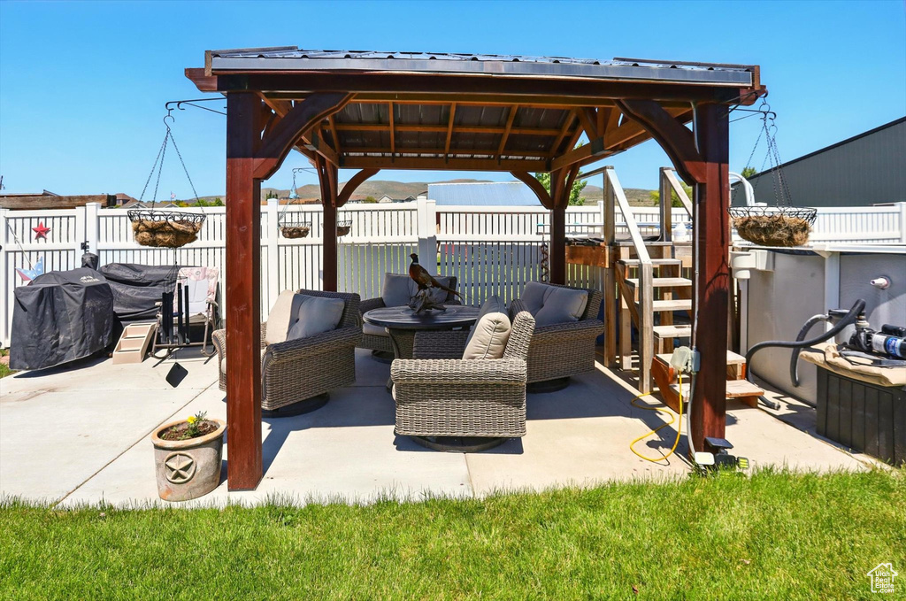 View of patio featuring a gazebo