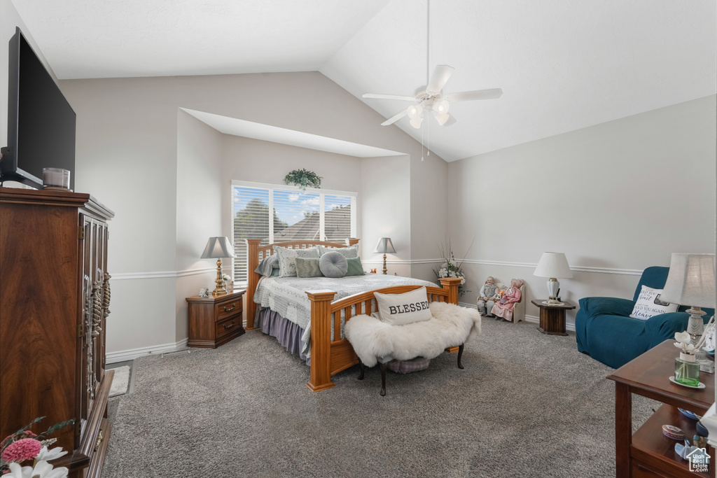 Bedroom with carpet floors, vaulted ceiling, baseboards, and ceiling fan