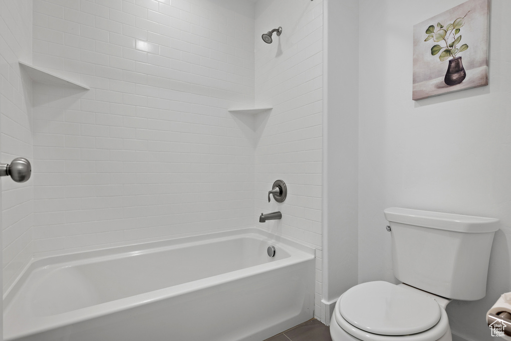 Full bathroom with toilet and bathtub / shower combination