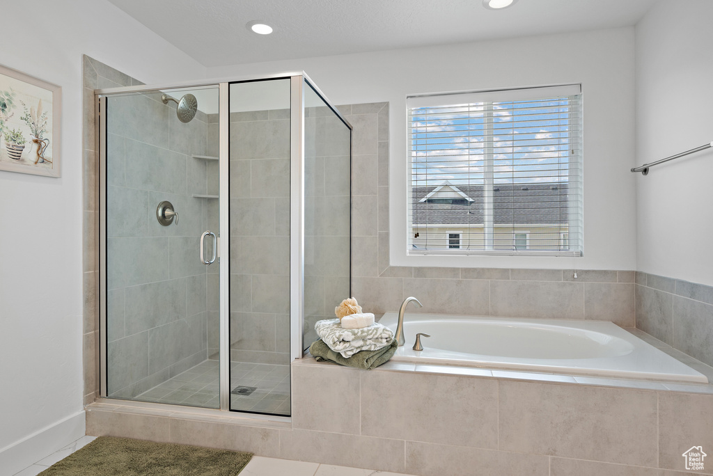 Bathroom with a garden tub, a stall shower, recessed lighting, and tile patterned floors