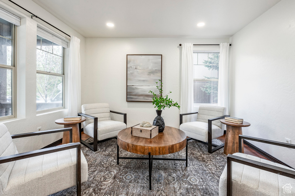 Living area featuring wood finished floors and recessed lighting
