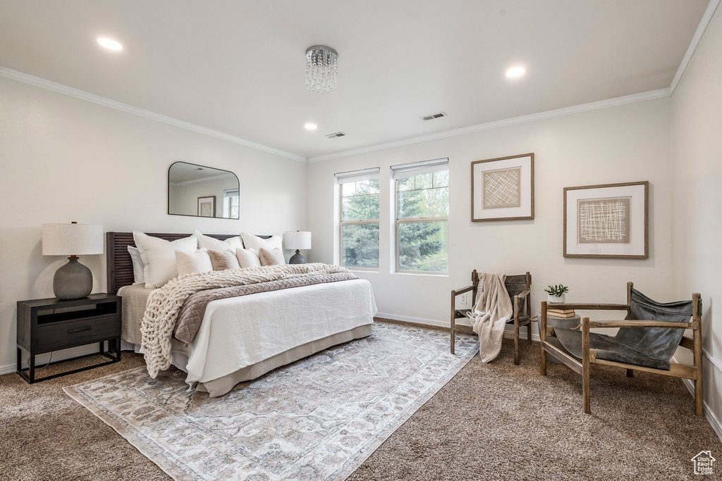 Carpeted bedroom with baseboards, ornamental molding, and recessed lighting