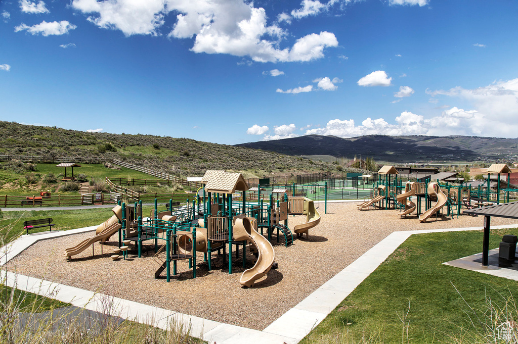 Communal playground featuring a mountain view