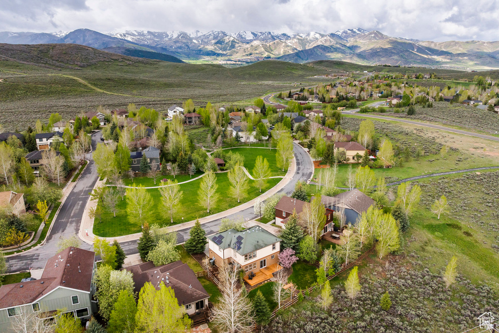 Aerial perspective of suburban area featuring a mountainous background